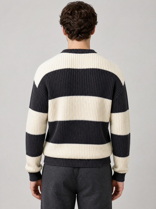 Back view of a black and cream striped knit sweater showing the shoulder line and sleeves