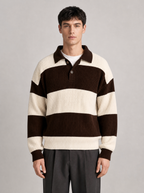 Man wearing a brown and cream striped knit polo sweater, front view on a light grey studio background