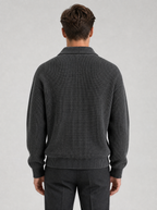 Back view of a charcoal half zip knit pullover showing the shoulder line and sleeves