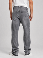 Back view of frost wash flare leg jeans showing the back pockets and yoke