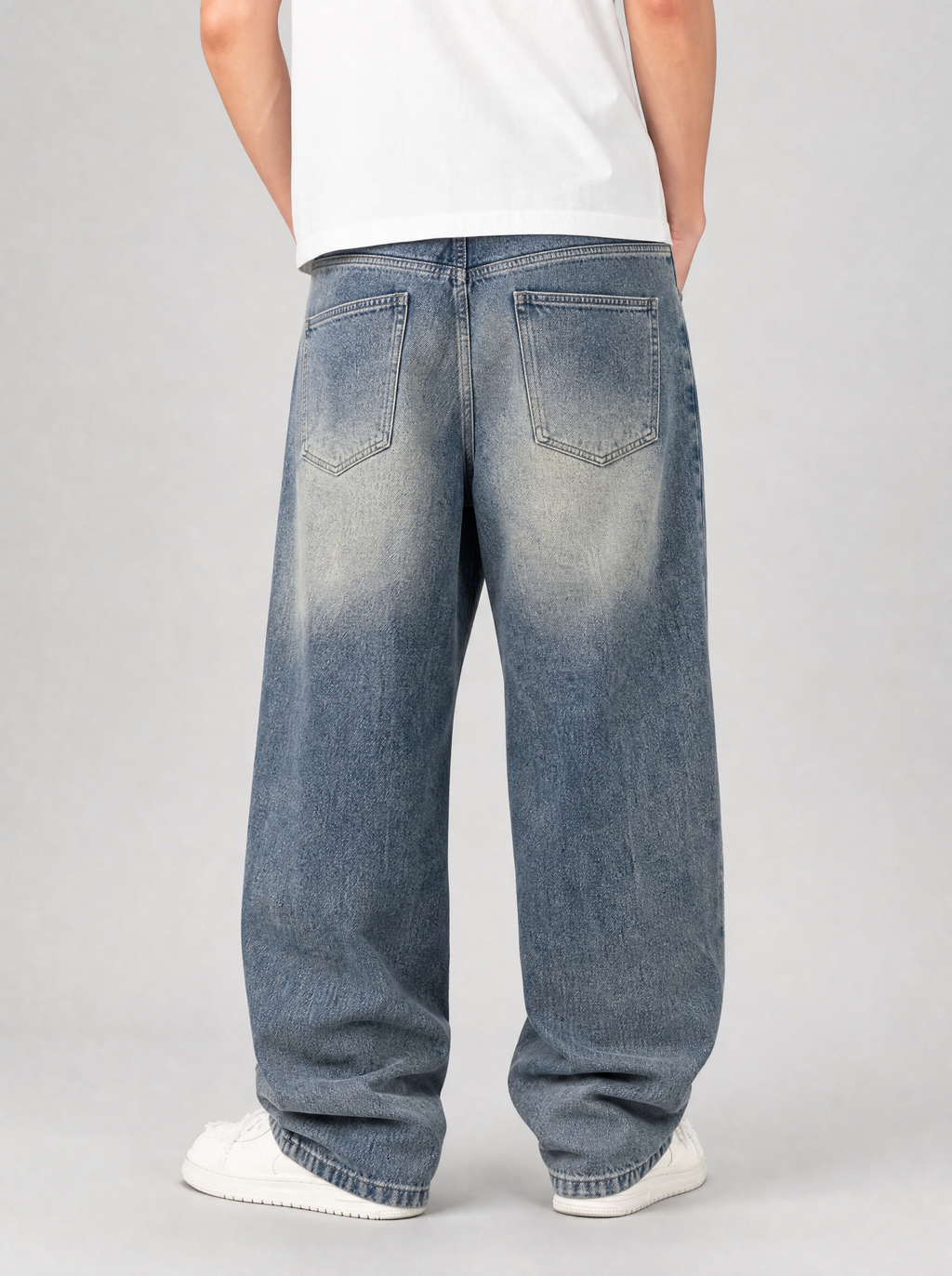 Back view of loose fit wide leg denim jeans showing the back pockets and yoke