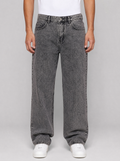 Man wearing smoke grey washed relaxed straight jeans, front view on a light grey studio background