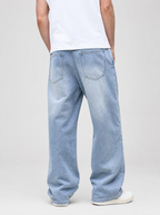 Back view of washed denim relaxed straight jeans showing the back pockets and yoke