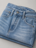 Close up of the waistband, shank button and pocket stitching on Y2K baggy wide leg jeans